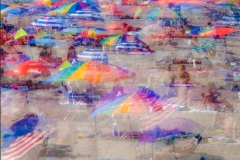 Bunched-up-Umbrellas-on-Beach-copy